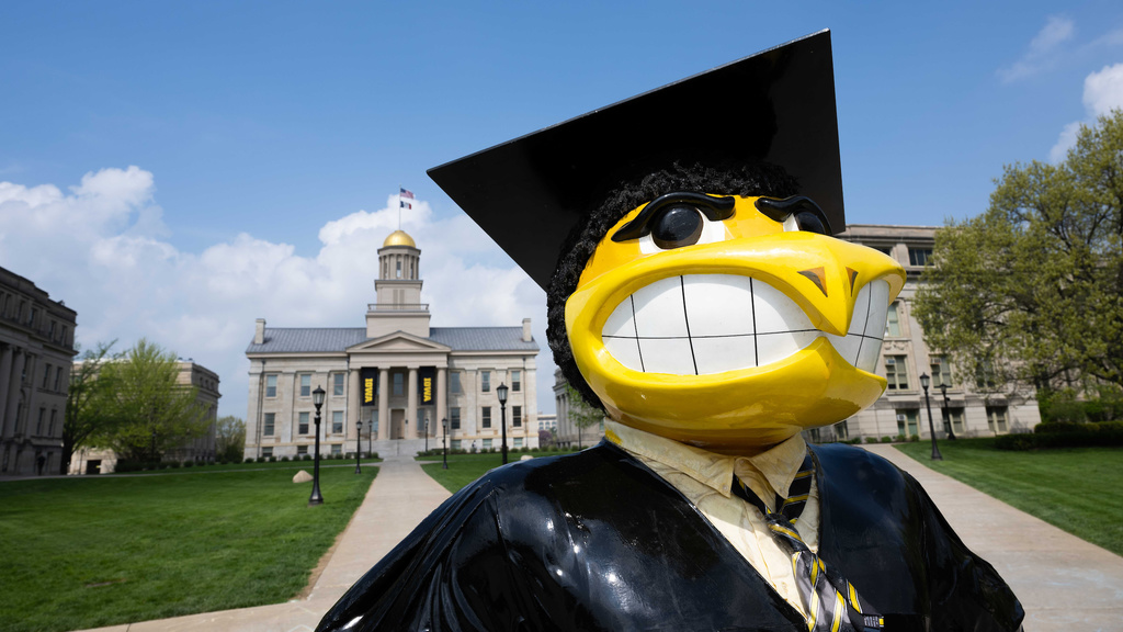 Graduate Herky statue in front of Old Capitol