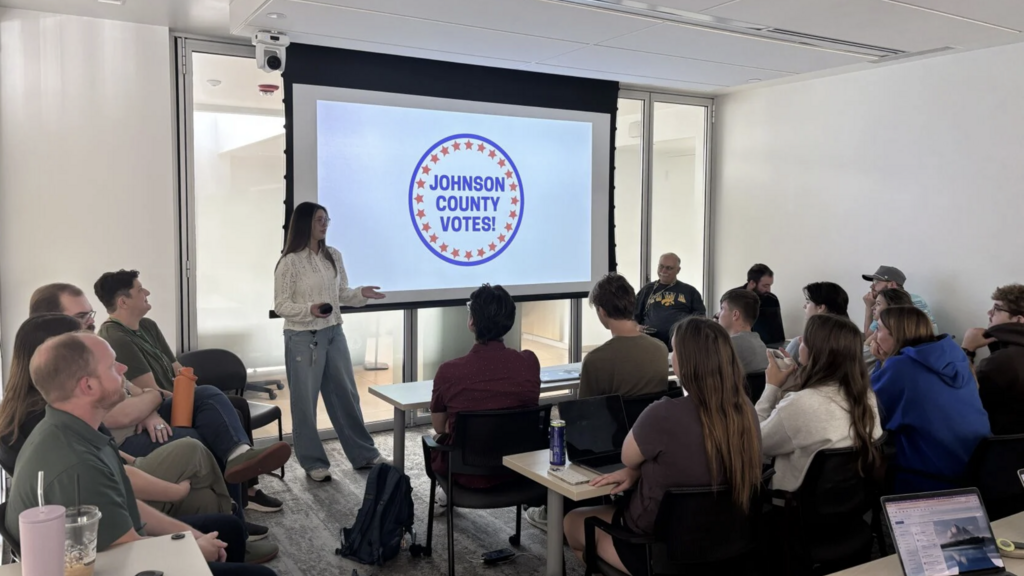 University of Iowa students in a classroom learn how to work the polls for Johnson's County's 2026 election.